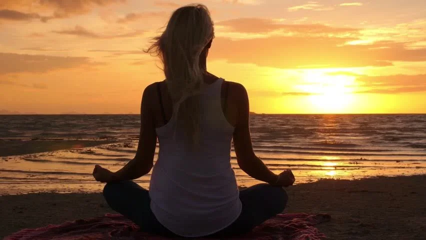 sunset woman meditating